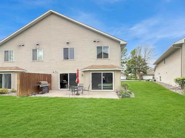 10809 Tyler Ct NE, Blaine, MN 55434 - back of property with a patio and a lawn