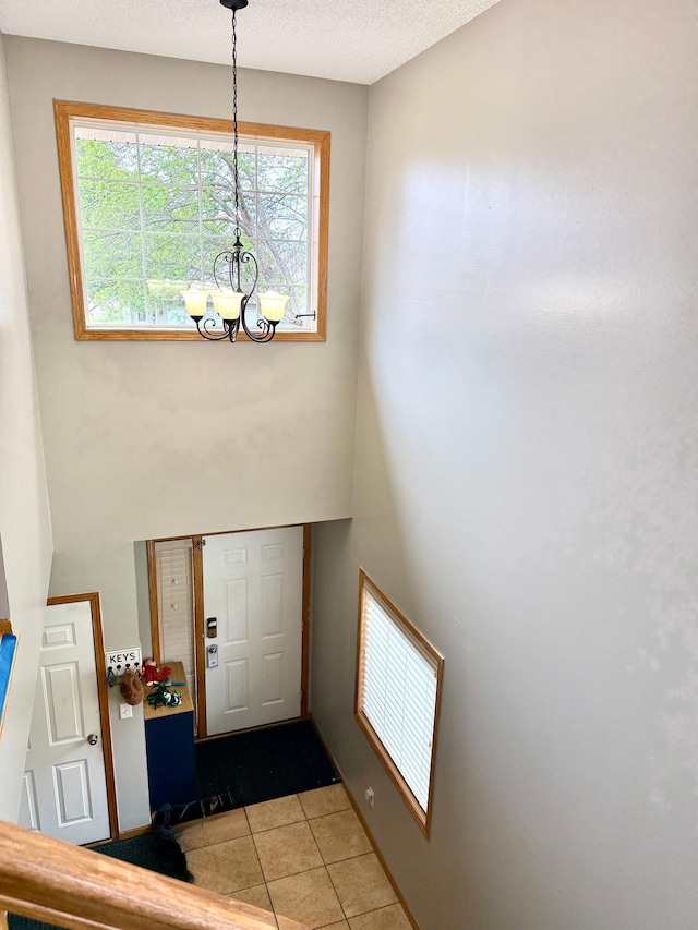 10809 Tyler Ct NE, Blaine, MN 55434 - entrance foyer featuring a chandelier and light tile patterned flooring