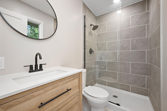 18120 27th Ave N, Plymouth, MN 55447 - bathroom featuring toilet, vanity, and tiled shower