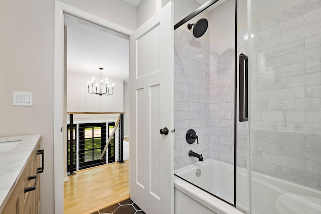 18120 27th Ave N, Plymouth, MN 55447 - full bathroom with enclosed tub / shower combo, a chandelier, vanity, and tile patterned flooring