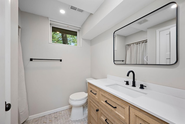 18120 27th Ave N, Plymouth, MN 55447 - full bathroom with vanity, toilet, baseboards, and recessed lighting