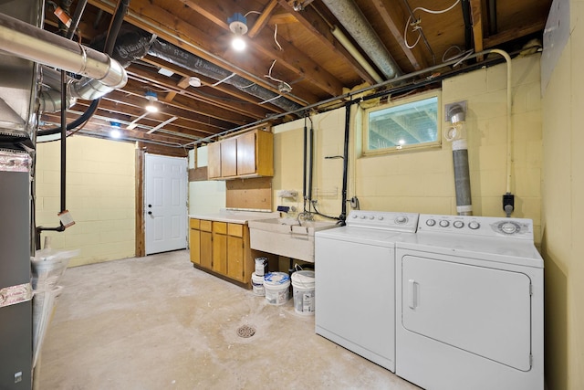 18120 27th Ave N, Plymouth, MN 55447 - unfinished basement with washing machine and clothes dryer, a sink, and concrete block wall