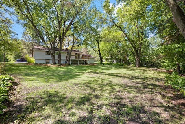 18120 27th Ave N, Plymouth, MN 55447 - view of grassy yard with a deck