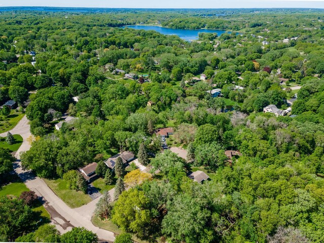 18120 27th Ave N, Plymouth, MN 55447 - aerial overview of property's location featuring a forest and a nearby body of water