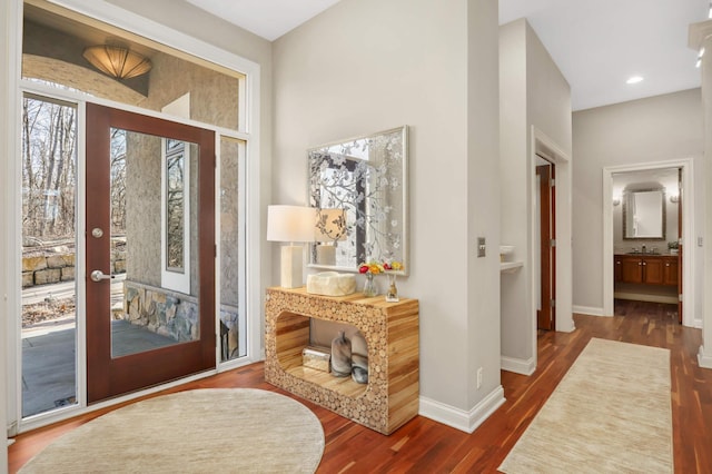4266 Manor Court Rd, Minnetonka, MN 55345 - foyer with dark wood finished floors, baseboards, and recessed lighting