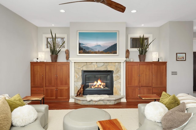4266 Manor Court Rd, Minnetonka, MN 55345 - living room featuring a ceiling fan, wood finished floors, a stone fireplace, and recessed lighting