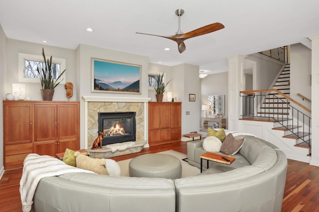 4266 Manor Court Rd, Minnetonka, MN 55345 - living area with wood finished floors, a fireplace, a ceiling fan, stairway, and recessed lighting