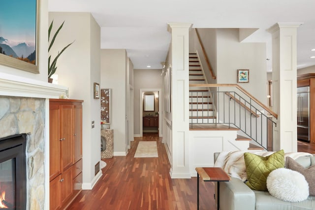 4266 Manor Court Rd, Minnetonka, MN 55345 - hall featuring dark wood-style flooring, decorative columns, stairs, recessed lighting, and baseboards
