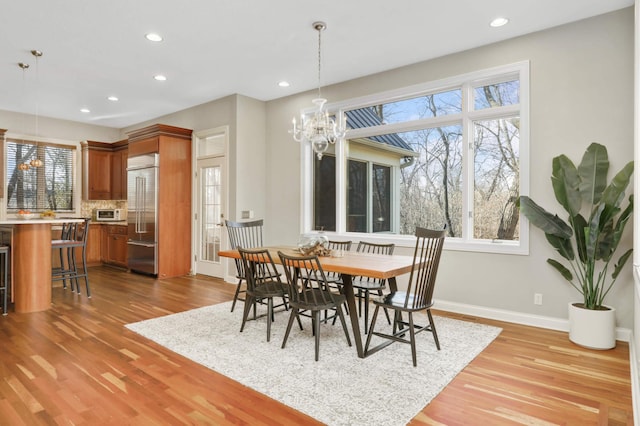 4266 Manor Court Rd, Minnetonka, MN 55345 - dining space with plenty of natural light, light wood-style floors, recessed lighting, baseboards, and a chandelier