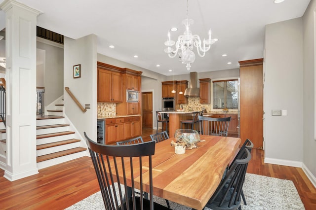 4266 Manor Court Rd, Minnetonka, MN 55345 - dining room with dark wood finished floors, baseboards, a chandelier, recessed lighting, and stairway