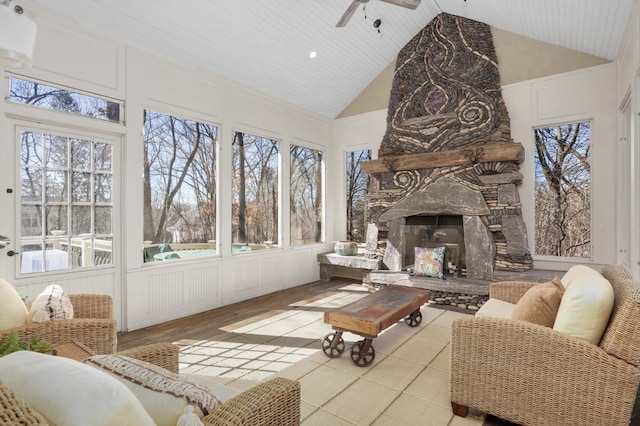 4266 Manor Court Rd, Minnetonka, MN 55345 - sunroom / solarium featuring ceiling fan, high vaulted ceiling, an outdoor living space with a fireplace, and healthy amount of natural light