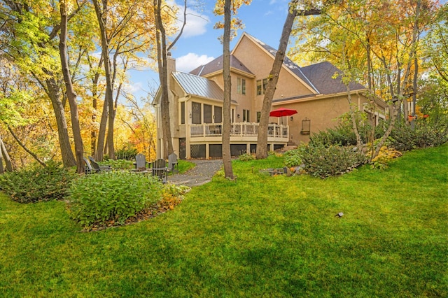 4266 Manor Court Rd, Minnetonka, MN 55345 - back of house featuring stucco siding, a chimney, a lawn, a wooden deck, and metal roof