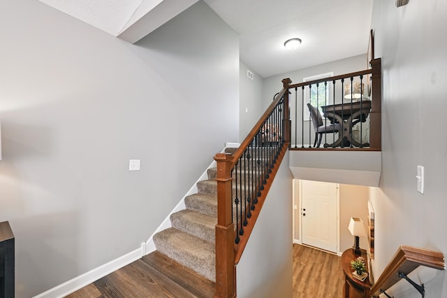 11350 97th Ave N, Maple Grove, MN 55369 - staircase featuring wood finished floors and baseboards