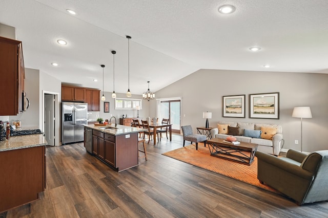 11350 97th Ave N, Maple Grove, MN 55369 - kitchen with appliances with stainless steel finishes, a sink, open floor plan, lofted ceiling, and a breakfast bar area