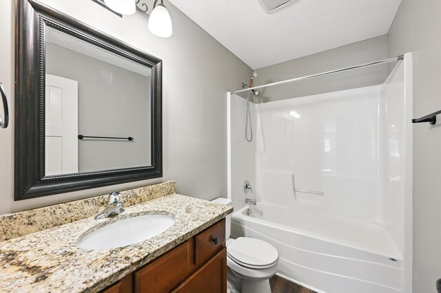 11350 97th Ave N, Maple Grove, MN 55369 - bathroom with toilet, vanity, and shower / washtub combination