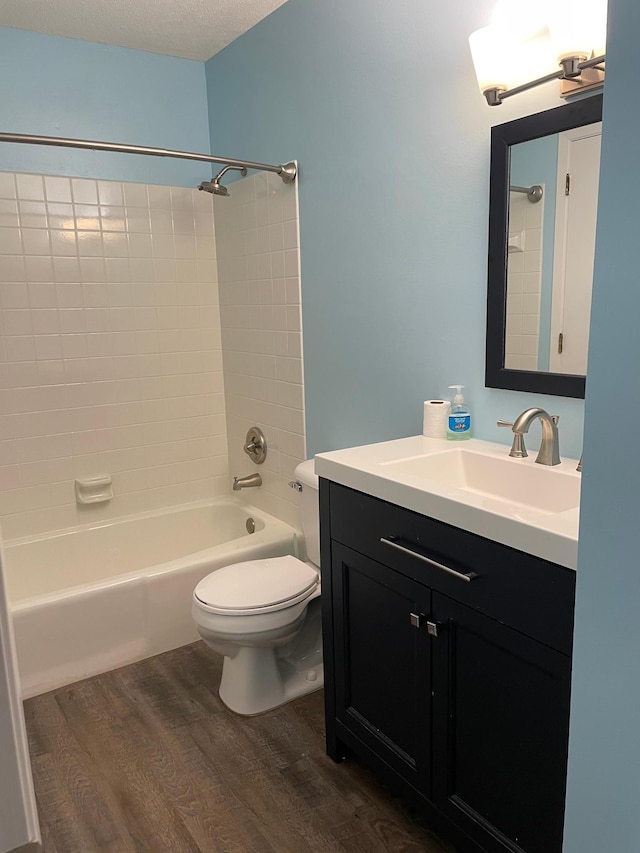 12232 Oak Leaf Cir, Burnsville, MN 55337 - full bath with wood finished floors, vanity, toilet, and shower / washtub combination