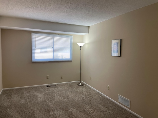 12232 Oak Leaf Cir, Burnsville, MN 55337 - carpeted empty room featuring baseboards and a textured ceiling