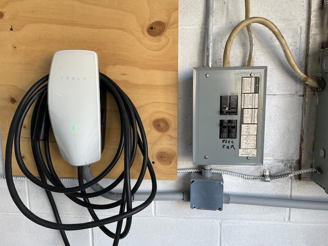 12232 Oak Leaf Cir, Burnsville, MN 55337 - garage view of electric vehicle charger and electric panel