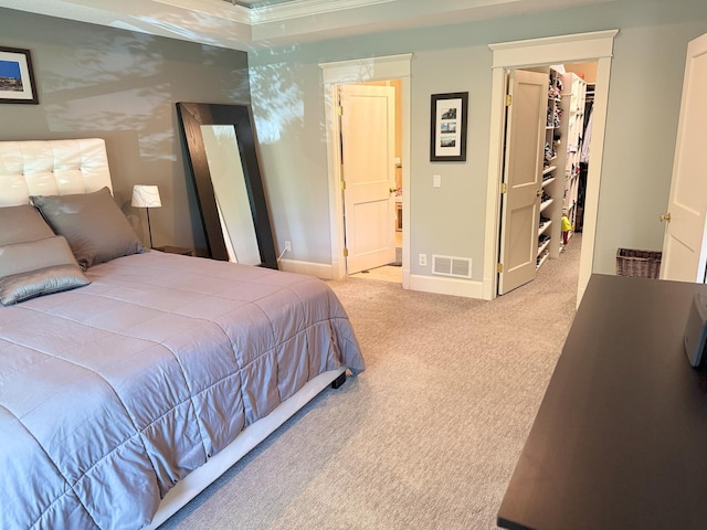 4312 France Ave S, Edina, MN 55410 - bedroom featuring a walk in closet, carpet floors, baseboards, crown molding, and a closet