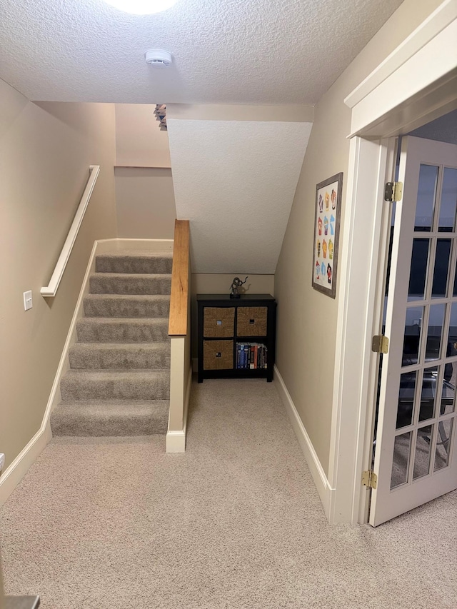 4312 France Ave S, Edina, MN 55410 - stairs with a textured ceiling, carpet, and baseboards