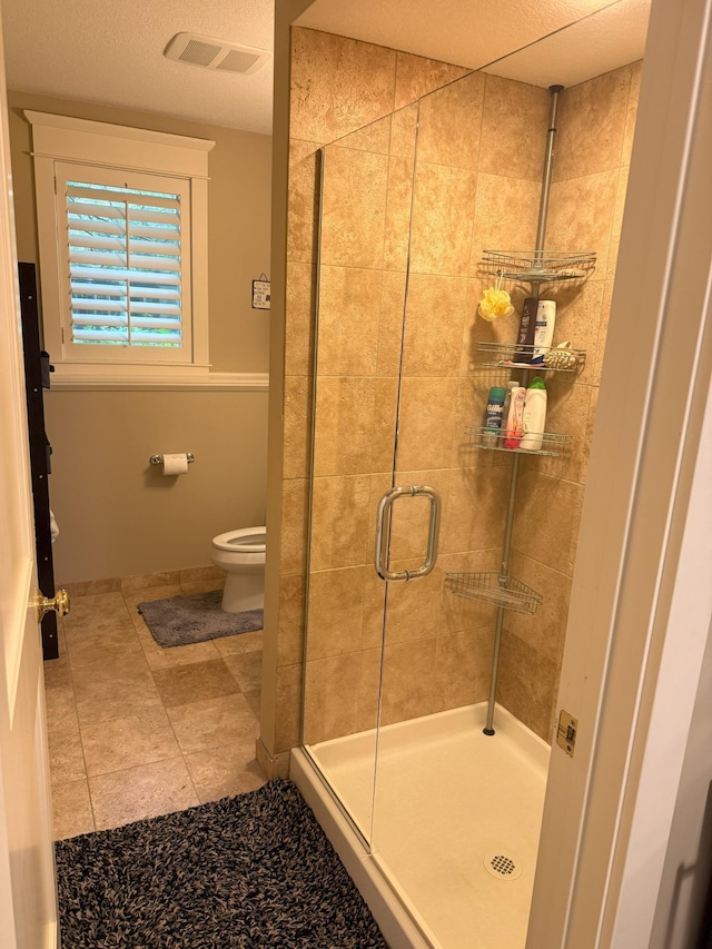 4312 France Ave S, Edina, MN 55410 - full bathroom featuring a shower stall, toilet, and tile patterned floors