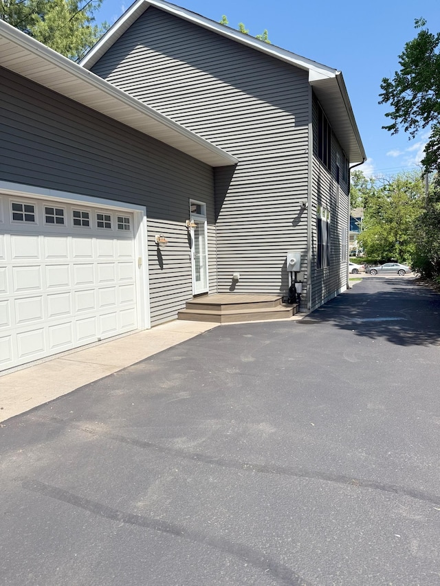 4312 France Ave S, Edina, MN 55410 - view of side of property with asphalt driveway and an attached garage