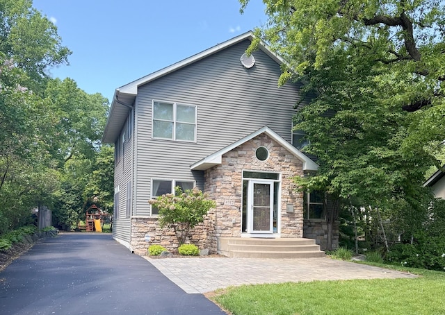 4312 France Ave S, Edina, MN 55410 - view of front of home featuring stone siding and asphalt driveway