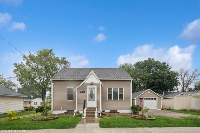 220 State St, Belle Plaine, MN 56011 - bungalow-style house featuring driveway, a garage, entry steps, and a front yard
