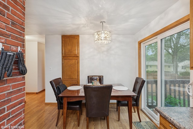 220 State St, Belle Plaine, MN 56011 - dining room featuring light wood-style floors and a chandelier