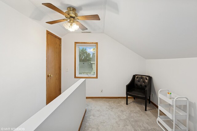 220 State St, Belle Plaine, MN 56011 - living area featuring vaulted ceiling, light colored carpet, a ceiling fan, and baseboards