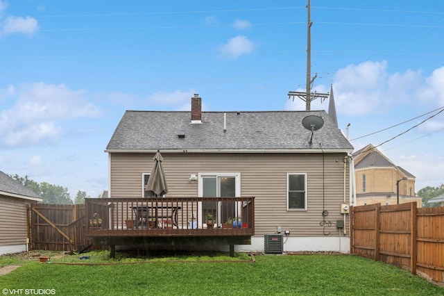 220 State St, Belle Plaine, MN 56011 - back of property featuring a deck, a chimney, central AC, and roof with shingles