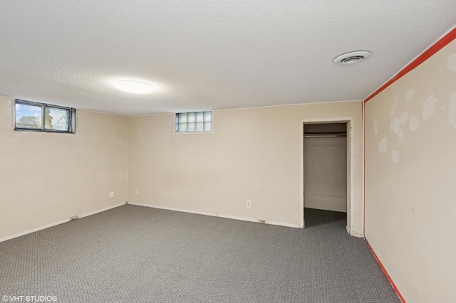 220 State St, Belle Plaine, MN 56011 - basement with a textured ceiling, carpet flooring, and baseboards
