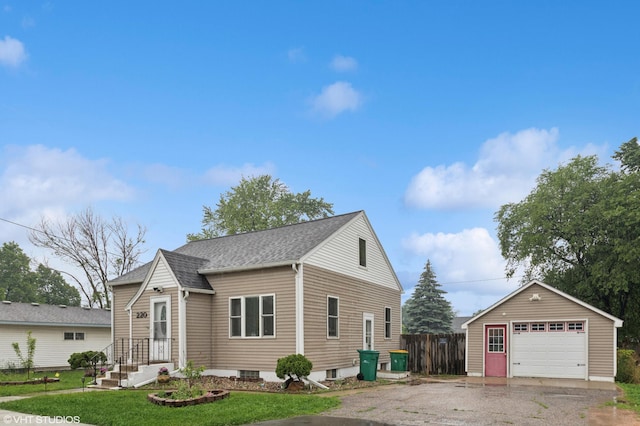 220 State St, Belle Plaine, MN 56011 - view of front of house with a detached garage, an outdoor structure, asphalt driveway, and roof with shingles