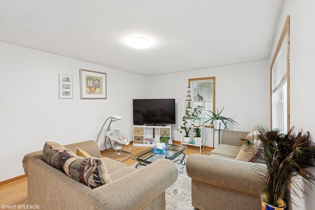 220 State St, Belle Plaine, MN 56011 - living area with wood finished floors and baseboards