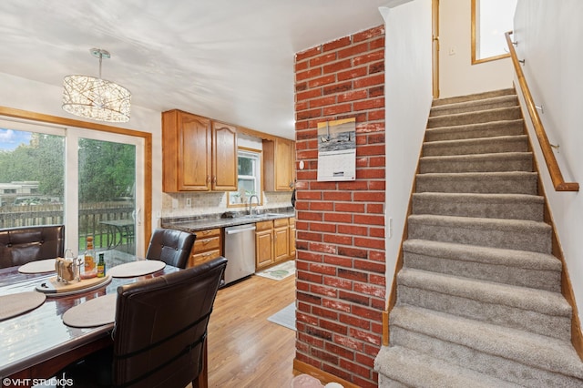 220 State St, Belle Plaine, MN 56011 - kitchen featuring dishwasher, light wood-type flooring, healthy amount of natural light, and a chandelier