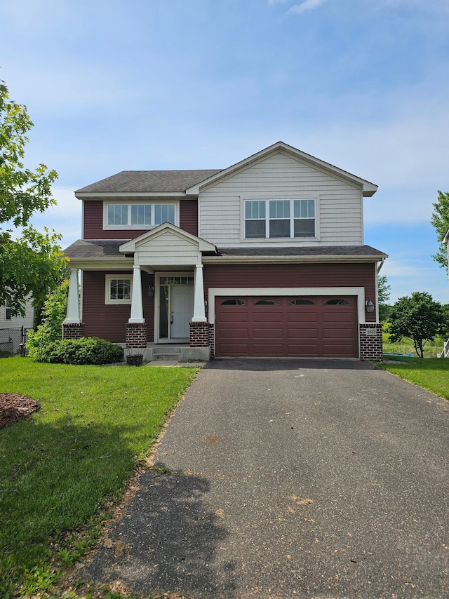 4629 Empress Way N, Hugo, MN 55038 - view of front facade featuring a front yard, an attached garage, asphalt driveway, and brick siding