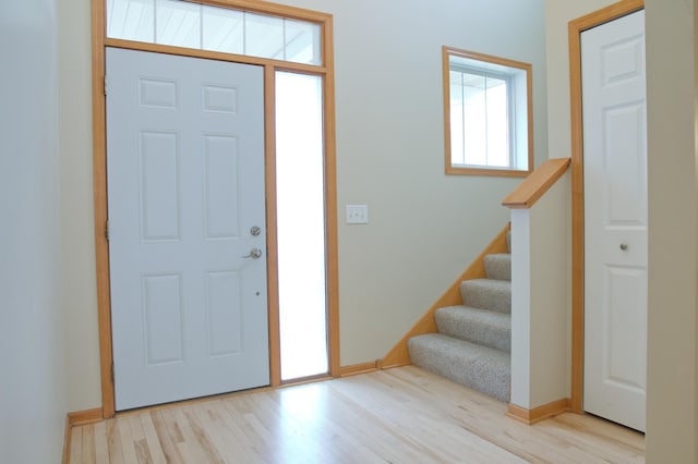 4629 Empress Way N, Hugo, MN 55038 - foyer with wood finished floors, stairway, and baseboards