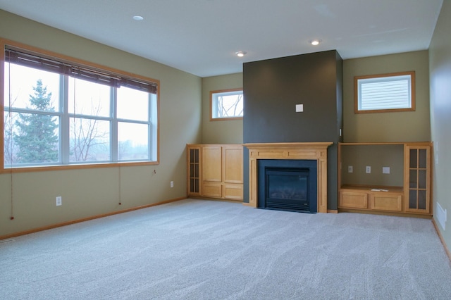 4629 Empress Way N, Hugo, MN 55038 - unfurnished living room featuring carpet flooring, baseboards, a fireplace with flush hearth, and recessed lighting