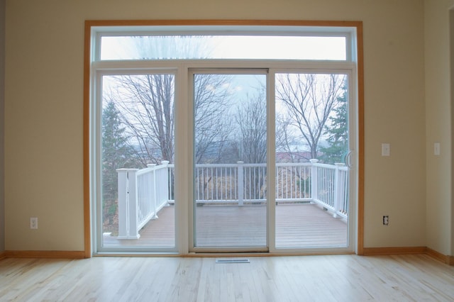 4629 Empress Way N, Hugo, MN 55038 - doorway with wood finished floors, baseboards, and plenty of natural light