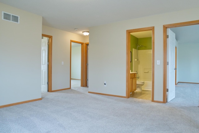 4629 Empress Way N, Hugo, MN 55038 - unfurnished bedroom with light colored carpet, baseboards, and connected bathroom