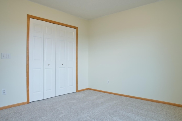 4629 Empress Way N, Hugo, MN 55038 - unfurnished bedroom featuring carpet flooring, baseboards, and a closet