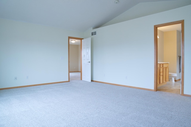 4629 Empress Way N, Hugo, MN 55038 - spare room featuring light colored carpet, lofted ceiling, and baseboards