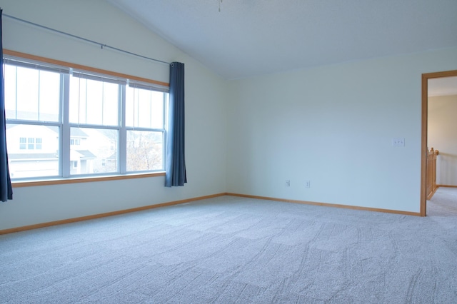 4629 Empress Way N, Hugo, MN 55038 - empty room featuring lofted ceiling, light colored carpet, and baseboards