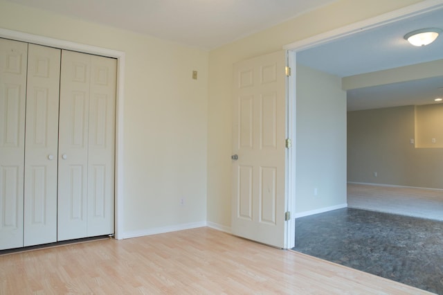 4629 Empress Way N, Hugo, MN 55038 - unfurnished bedroom with light wood finished floors, a closet, and baseboards