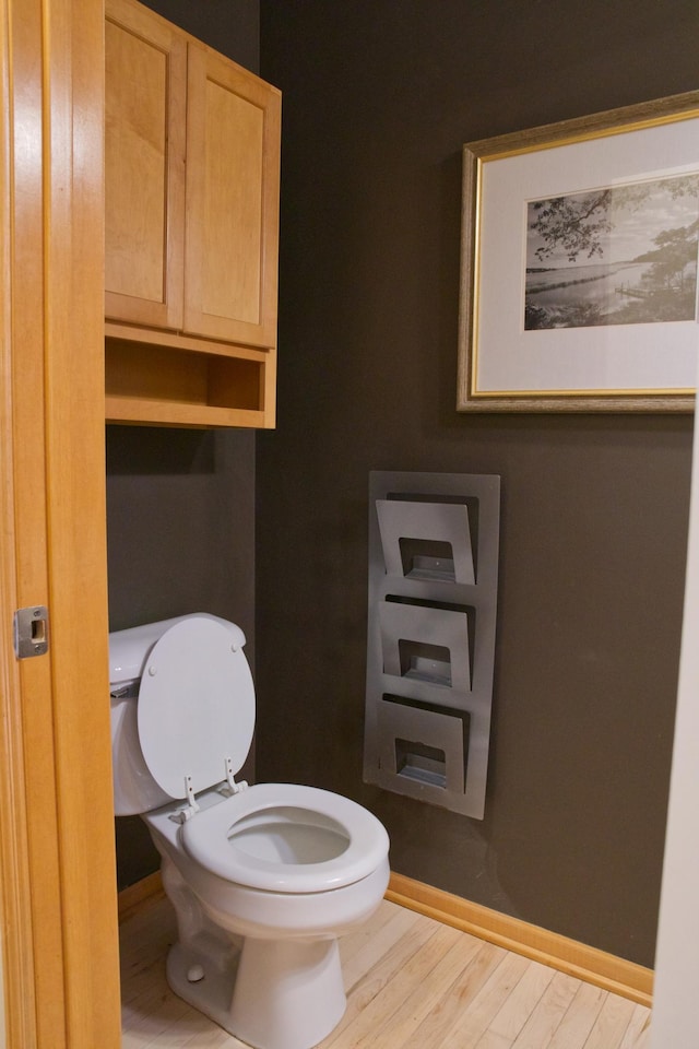 4629 Empress Way N, Hugo, MN 55038 - bathroom with toilet, wood finished floors, and baseboards