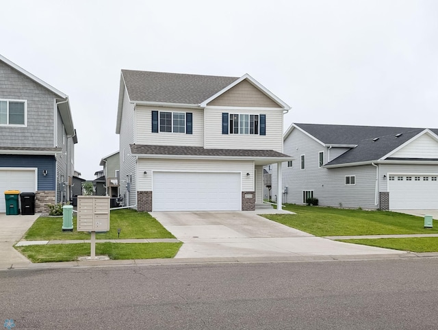 2715 11th St W, West Fargo, ND 58078 - view of front of house featuring a front lawn, brick siding, concrete driveway, an attached garage, and a shingled roof
