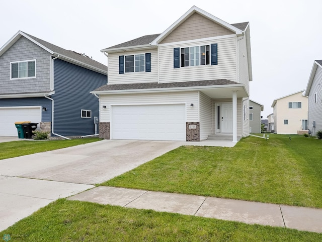 2715 11th St W, West Fargo, ND 58078 - view of front of home with a garage, a front lawn, driveway, and brick siding