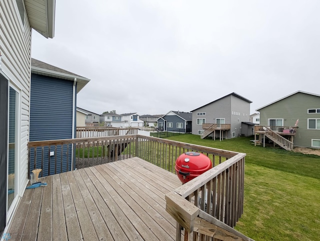 2715 11th St W, West Fargo, ND 58078 - wooden terrace with a residential view, a lawn, and stairway