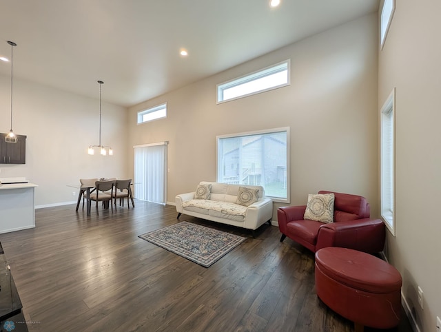 2715 11th St W, West Fargo, ND 58078 - living room with dark wood-style floors, a towering ceiling, recessed lighting, and a chandelier