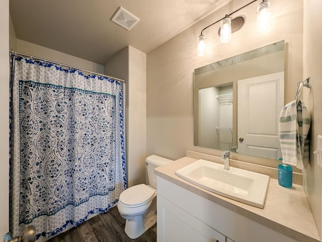 2715 11th St W, West Fargo, ND 58078 - full bathroom featuring vanity, wood finished floors, and a shower with curtain